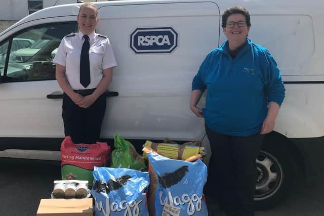 Inspector Alison Fletcher with a volunteer at the RSPCA Food Bank partnership