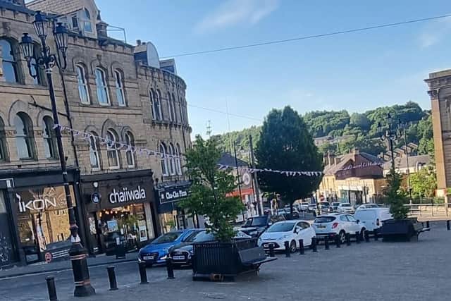 Market Place in Batley, where the narrow cut-through is made problematic by on-street parking and a taxi rank