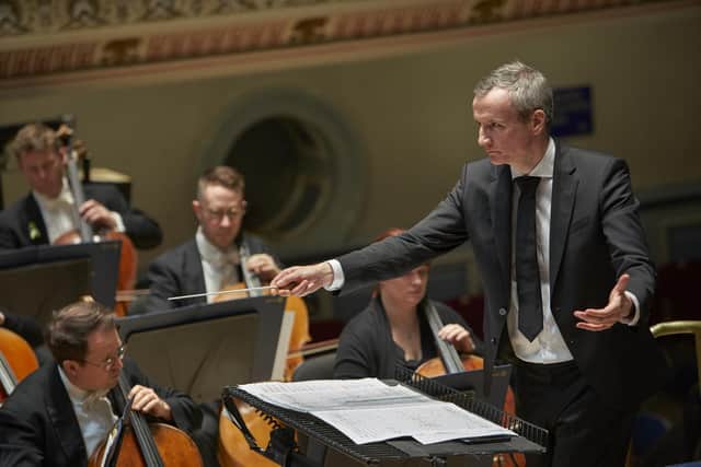 Garry Walker conducts the Orchestra of Opera North at Huddersfield Town Hall. Photo: Justin Slee.