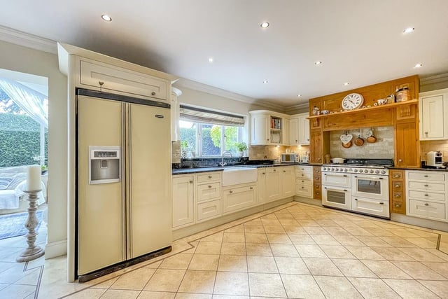 Fitted units and integrated appliances within the kitchen area.