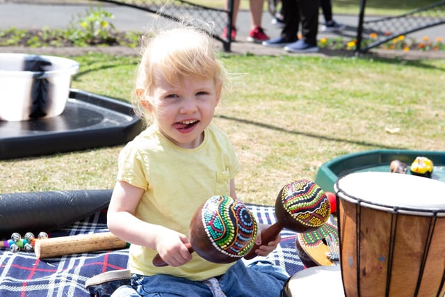 Two-year-old Willow Brook making tunes at the Heckmondwike Great Get Together in Green Park