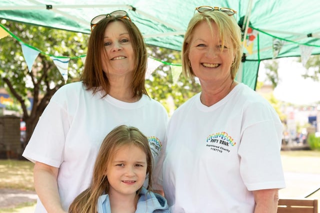 Angela and Millie Surtees with Samantha Cottam, from Rainbow Baby Bank, at the Heckmondwike Great Get Together in Green Park