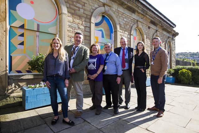 Kim with Upper Batley High School assistant head teacher Nial Sherrard; Gwen Lowe, chairman of Friends of Batley Station; Northern communities manager Richard Isaac; Northern stakeholder manager Pete Myers; Amy Foster from Creative Scene; and station manager Dean Howard at the launch of the street art trail at Batley Train Station in October 2021. Photo: Jim Fitton