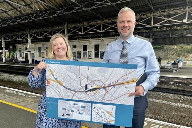 Neil Holm (right), Transpennine Route Upgrade director, with Hannah Lomas (left), principal programme sponsor, at Huddersfield Station