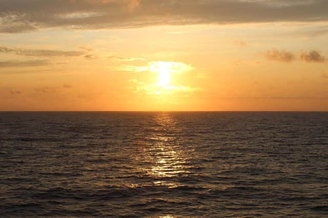 Sunset at sea. Photo by Liz Greenough