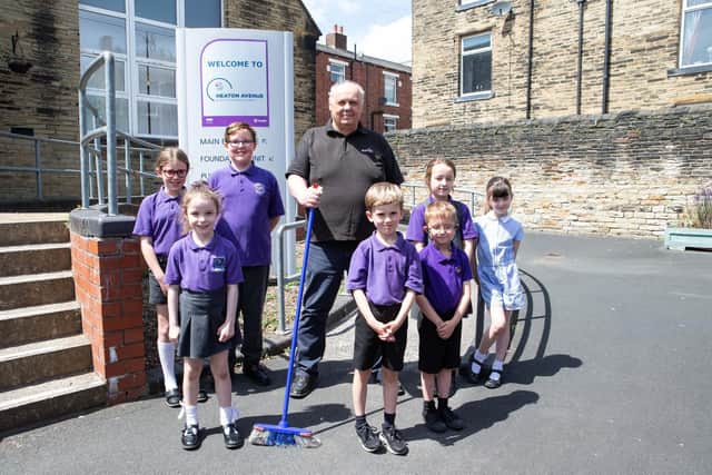 Caretaker Mick Gibson with pupils at Heaton Avenue Primary School