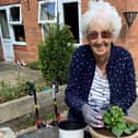 June Stephenson in the garden at Ashworth Grange care home, Dewsbury