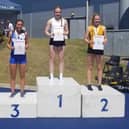 Spenborough AC’s Natalie Groves on the podium after receiving her bronze medal at the English Schools Track and Field Championships Finals in Manchester.