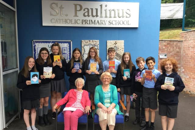 Year six pupils with silver listeners Kathleen Riordan and Shirley Booth.