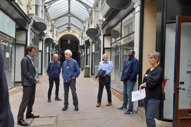 Panel members take a look around The Arcade