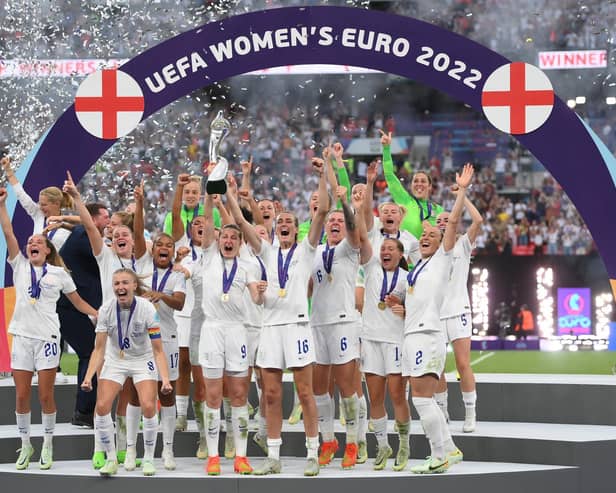 The England team lifting the UEFA Women's EURO 2022 Trophy.