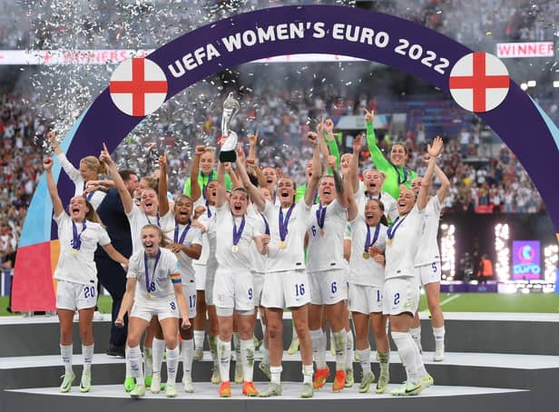 The England team lifting the UEFA Women's EURO 2022 Trophy.