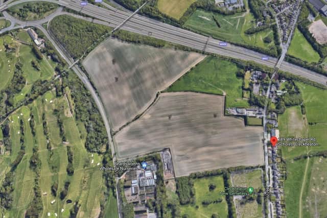 An aerial view of the proposed Amazon warehouse site in Scholes, near Cleckheaton, showing its proximity to local houses. It is bordered by the M62 on one side, a cemetery, Whitechapel Road and Whitehall Road. Photo: Google