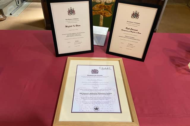 The Queen's Award for Voluntary Service along with the two Kirklees Council certificates, which were presented by Mayor Masood Ahmed.