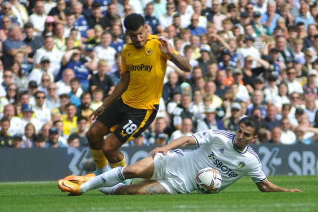 Pascal Struijk slides in to try to win the ball off Wolves' Morgan Gibbs-White.