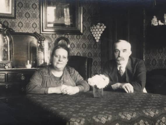SIMPLE LIVING: Charlotte Sykes and her husband pictured in the 1930s in their home in Brook Street, Dewsbury, a back-to-back house which was demolished in the 1960s.