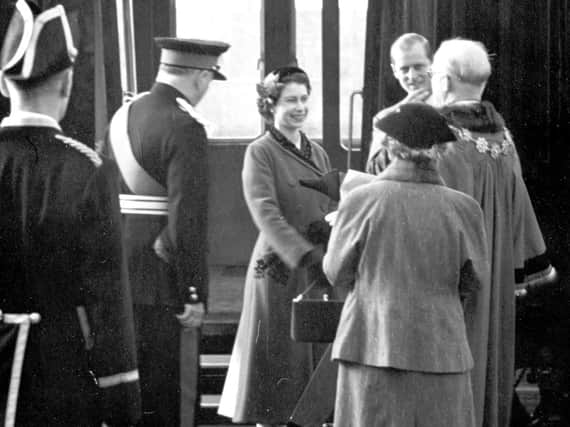 The Queen and the Duke of Edinburgh arriving at Dewsbury Central Railway Station on October 28, 1954.