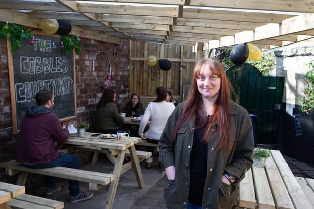 Donna Pailing, at The Cobbles, Birstall, has demolished an outside toilet to create a cobbled courtyard for her cafe business so she has an outside eating area