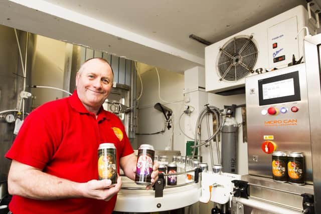 Steve Hemingway with the new canning machine at Mill Valley Brewery, Liversedge.