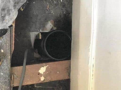 A photograph of the drainpipe 'shoot' that allowed illegal tobacco to be dropped into a secret drawer in the Polski Sklep shop on Foundry Street in Dewsbury. Image: West Yorkshire Trading Standards