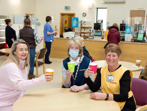 Clare Naughton, Lynda Dews and Rosemary Buckingham, volunteers at The Ridings voluntary cafe, celebrate being able to keep the cafe open at Dewsbury and District Hospital