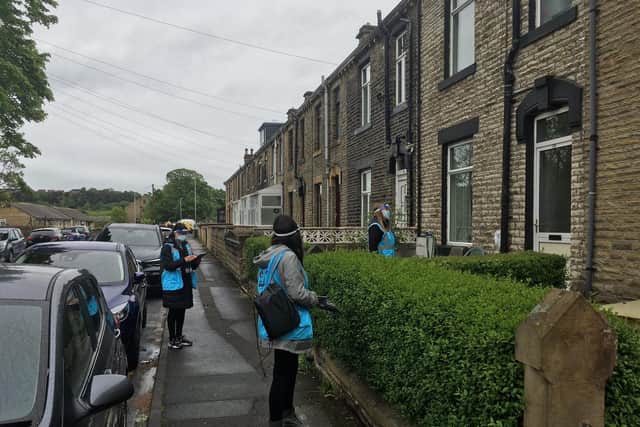 Health teams go door-to-door in Savile Town, Dewsbury to encourage local people to get tested for Covid-19