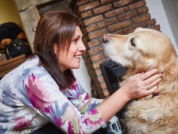 Lindsey Moore, of Gomersal, with her guide dog Charlotte, who passed away last year