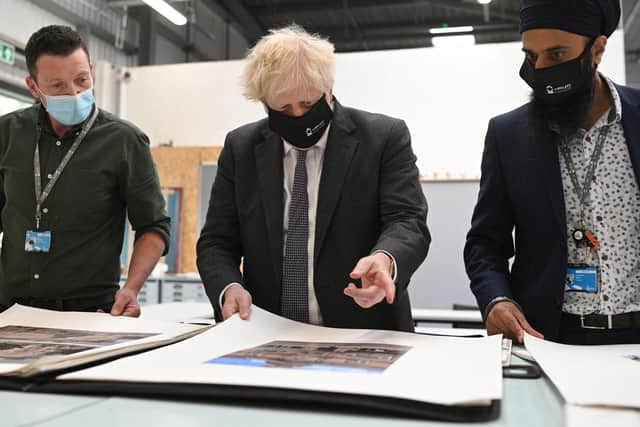 Prime Minister Boris Johnson chats with teachers in the arts and design area during a visit to Kirklees College in Dewsbury. Photo: Getty Images