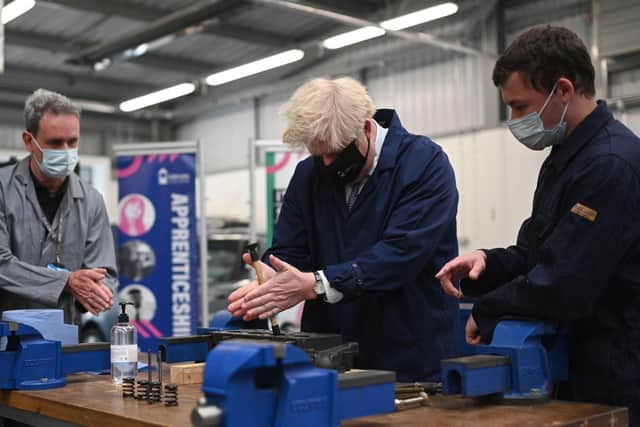 The Prime Minister visited Kirklees College in Dewsbury earlier in the day, where he tried his hand at an engine repair in the automotive workshop. Photo: Getty Images