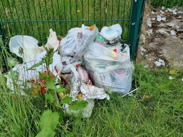 Rubbish left behind by travellers who camped near playing fields in Mirfield