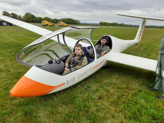 Cadet Aiden Booth in the glider preparing for launch