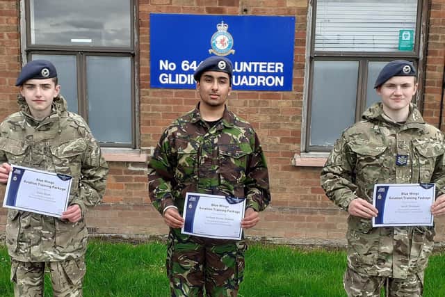Cadets Aiden Booth, Gurdeep Kumar-Sharma and Flight Sergeant Jacob Stockwell showing their badges and certificates