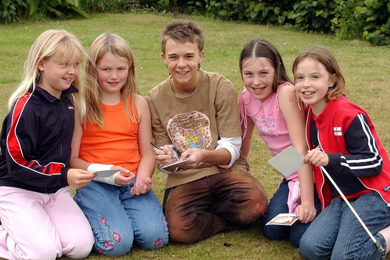 Actor Jack P Shepherd from Pudsey, who played David Platt in Coronation Street, officially opened Adel Primary School's summer fayre. He is picured with, left to right, Jessica Quinn, Charlotte Ford, Abi Wilkinson and Eleanor Cawthra.