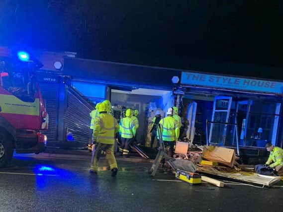 Two people were seriously injured when a BMW car crashed into a pet shop in Heckmondwike on Monday night (July 5)