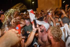 ENGLAND FANS: Celebrating after a win. Photo: Getty Images