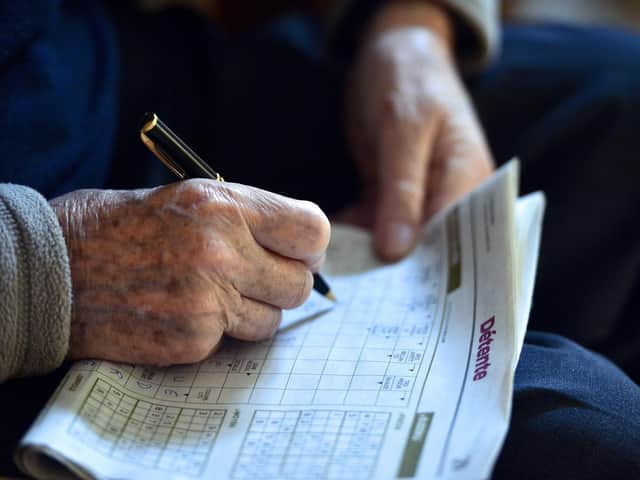 Keep the brain active doing things like crosswords or sudoku puzzles. Photo: Getty Images