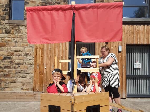 Children playing on the pirate ship at the end of term event