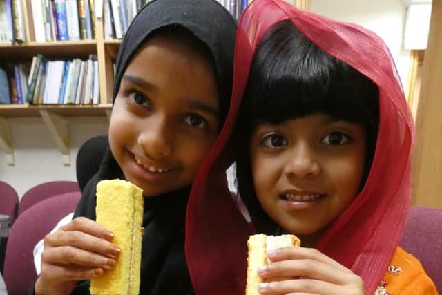 Maddrassah pupils from the Kanzul-Iman Jamia Mosque about to tuck into some creamy cakes