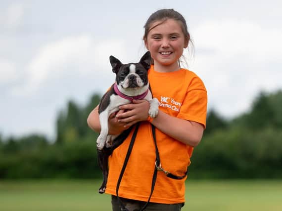 Grace Adams, nine, of Mirfield, with her Boston Terrier, Dorothy. Photo: The Kennel Club