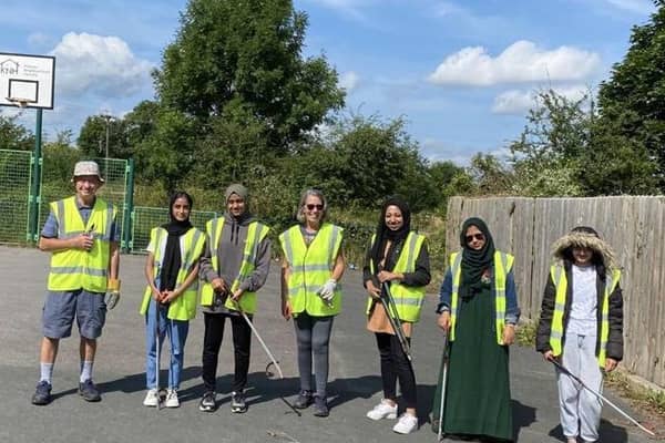 Dewsbury South councillor Jackie Ramsay and volunteers helped a group of boys improve the play area at Ouzelwell Lane, Thornhill Lees