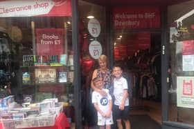 Jackie Squires, manager of the British Heart Foundation shop in Dewsbury, with her grandsons Jacob and Noah, who raised £457 for the charity by holding a raffle