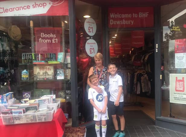 Jackie Squires, manager of the British Heart Foundation shop in Dewsbury, with her grandsons Jacob and Noah, who raised £457 for the charity by holding a raffle