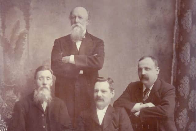 Former editor William W Yates, back, with the first reporters at the Dewsbury Reporter