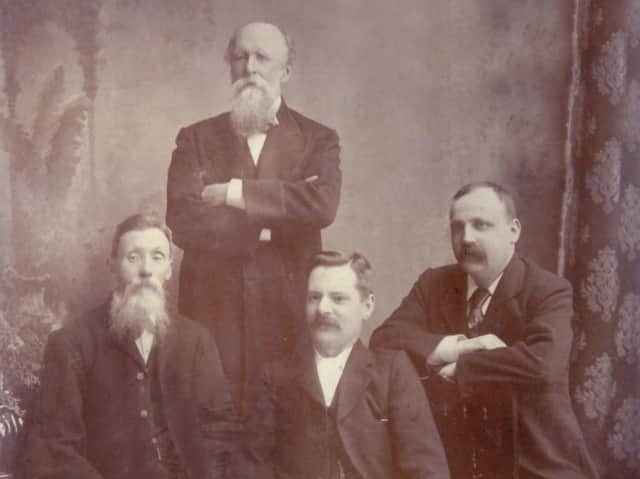 Former editor William W Yates, back, with the first reporters at the Dewsbury Reporter