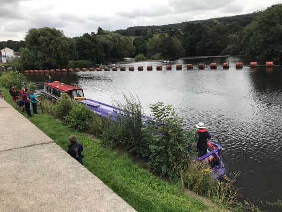 Riverboats became stuck on a weir on the River Calder at Ravensthorpe