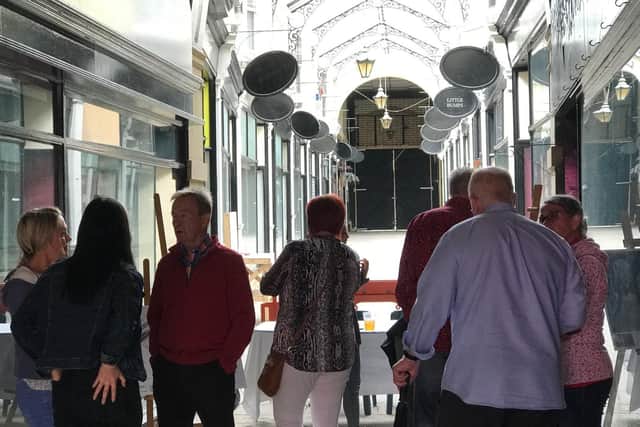 Visitors have a look at progress on the restoration of The Arcade in Dewsbury