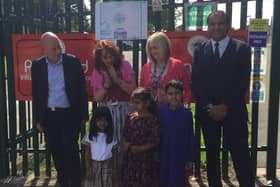 Dewsbury MP Mark Eastwood, school deputy head Pat Barker, head teacher Kathy Coates-Mohammed, Coun Masood Ahmed and three of the pupils who designed winning road safety posters