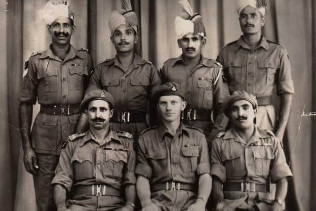 A regimental group photo of British-Indian Commandos who fought off a Japanese attack in Assam, India
