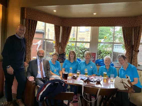 Dewsbury MP Mark Eastwood supporting the Bath Hotel's fundraising efforts, pictured the with 'Hug on a Tray' volunteers