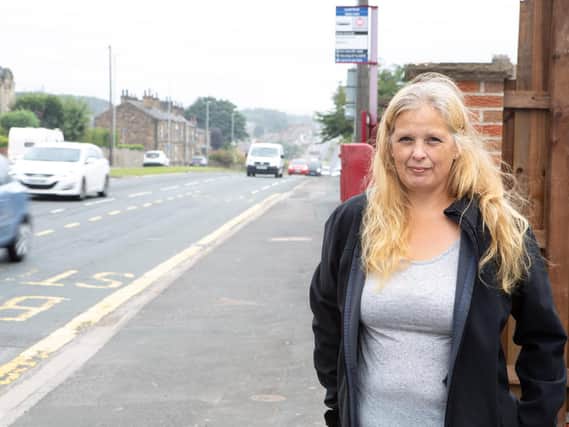 Julie Whitaker is campaigning for speed cameras on the road outside her home after two of her family's vehicles were written off after cars smashed into them on Leeds Road, Dewsbury